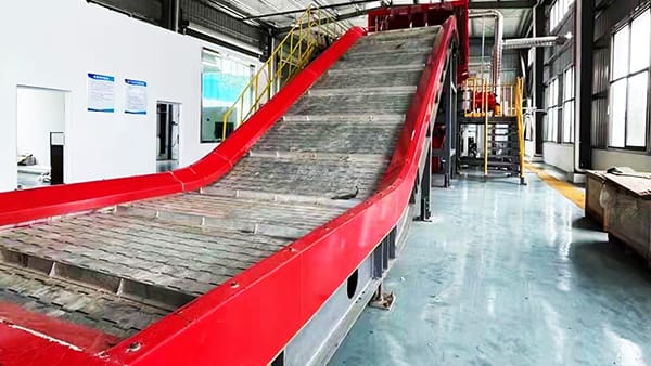 Transportador de placas metálicas